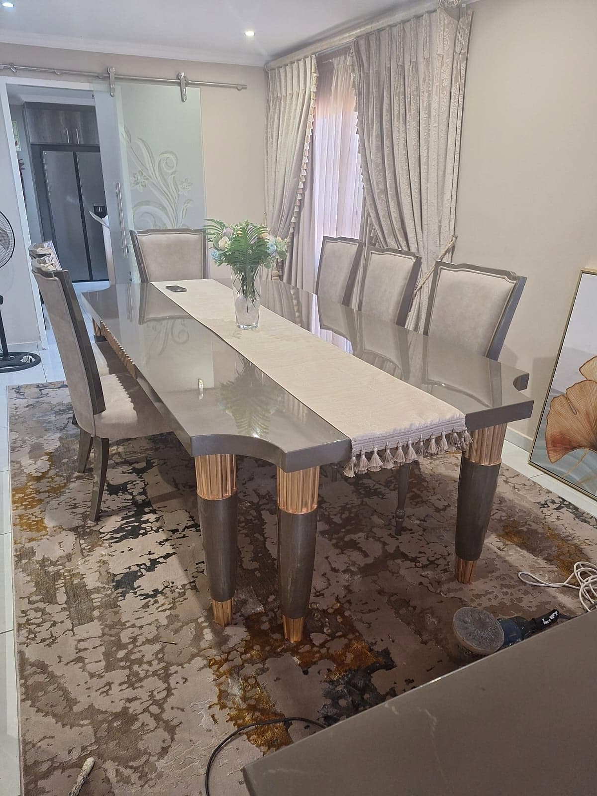 Dining table with rose gold legs and eight chairs