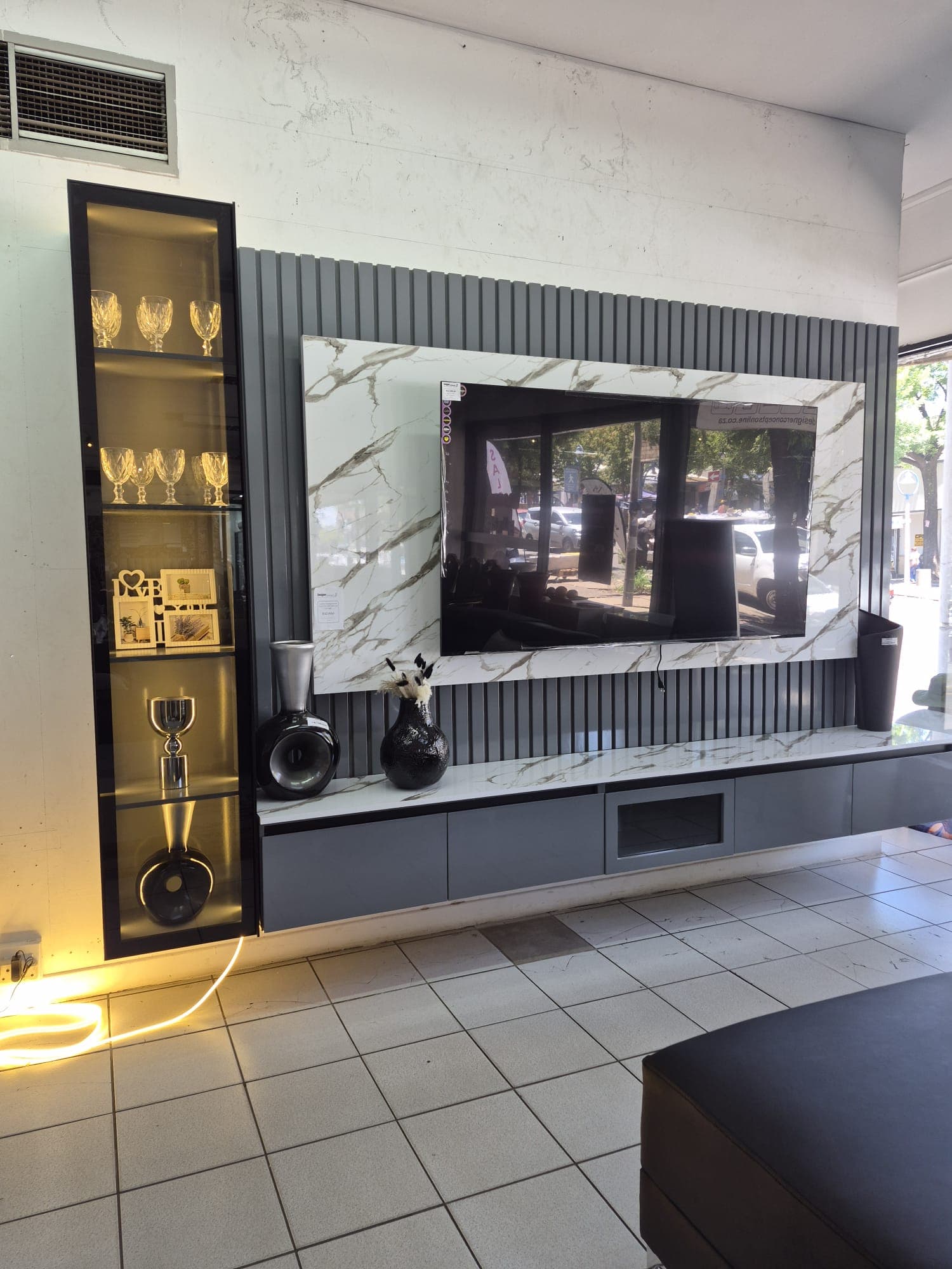TV wall console — left angle with glass display cabinet