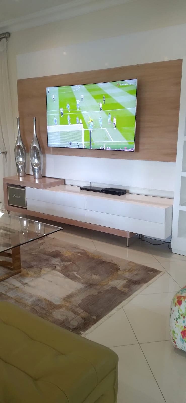 Wall console in wood finish with styling detail