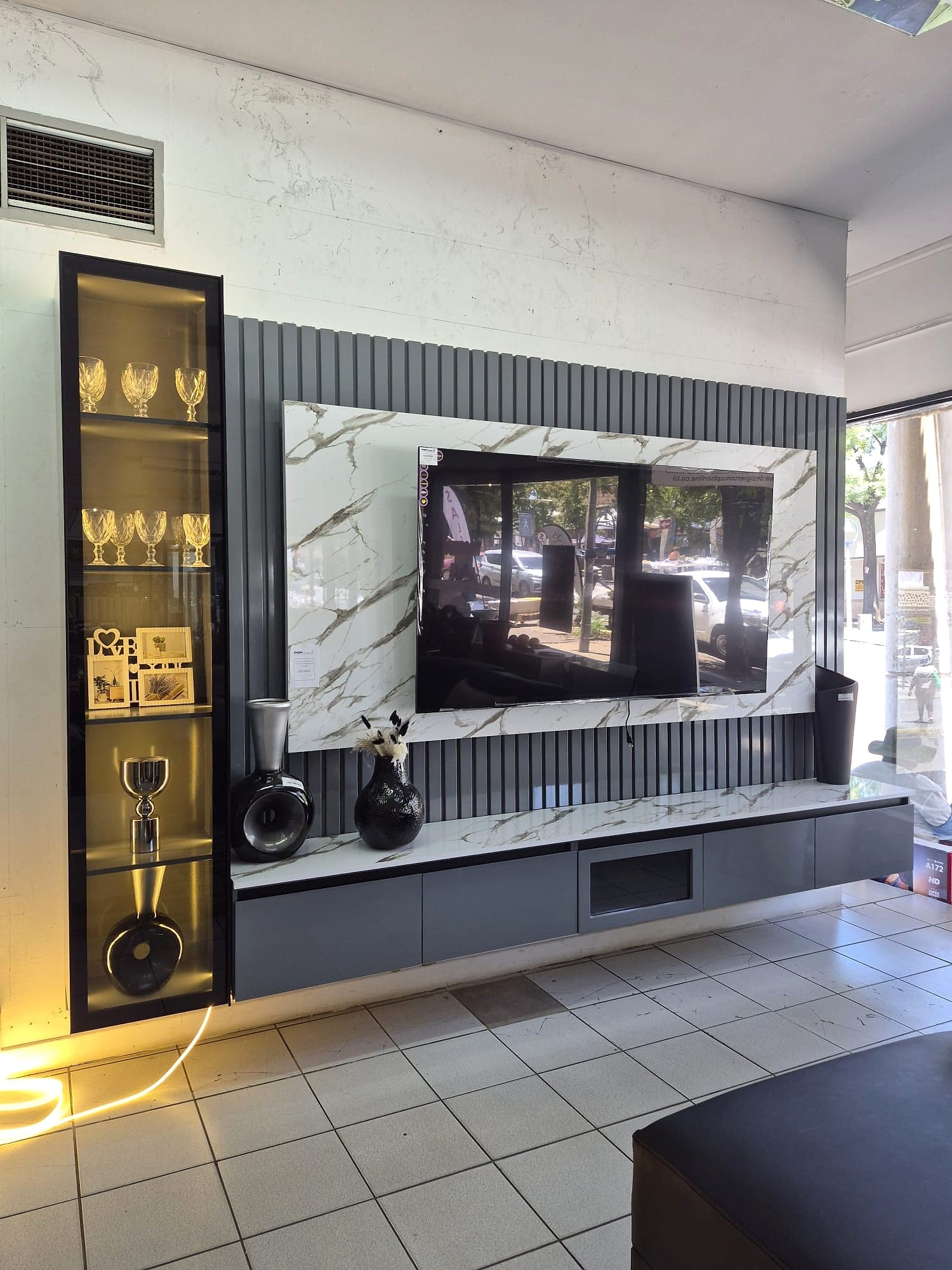 Marble grey fluted TV wall console styled in a showroom-style living space